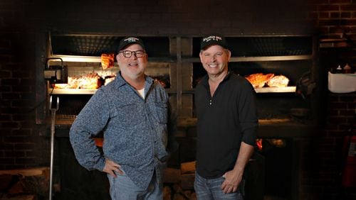 Larry Williamson (left) and brother Danny opened Williamson Bros. Bar-B-Q in 1990 with a location on Roswell Road in Marietta. CONTRIBUTED BY NATHAN PADGETT