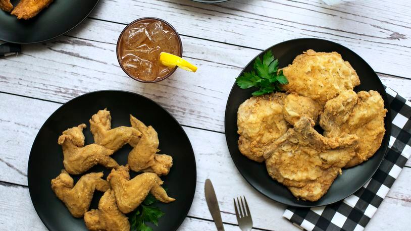 Chicken wings, iced tea, fried chicken and a pork chop are among the Southern classics at Busy Bee Cafe. Photo Courtesy of Morgen Purcell/Lemon Brands