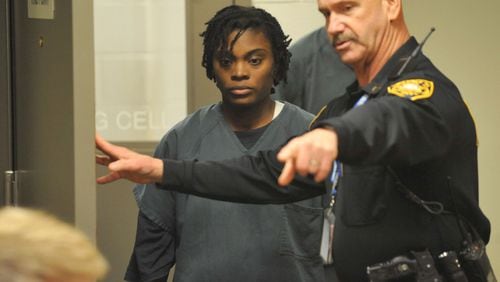 Tiffany Moss enters a Gwinnett County courtroom for her first appearance hearing after being charged with the murder of her stepdaughter, Emani. (KENT D. JOHNSON / KDJOHNSON@AJC.COM)