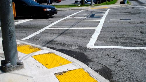 Freshly painted crosswalks and ramps to make access easier for the disabled or those with strollers were among the pedestrian improvements made at the intersection of LaVista and Cheshire Bridge roads. John Becker