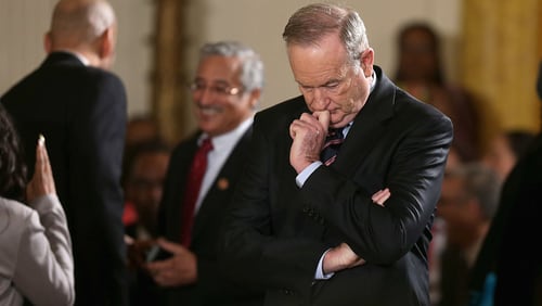 Former fox news host Bill O'Reilly, pictured here waiting for the arrival of U.S. President Barack Obama during an event at the White House in February of 2014 in Washington, is launching a new podcast Monday amid reports he’s getting a $25 million payout from Fox News.