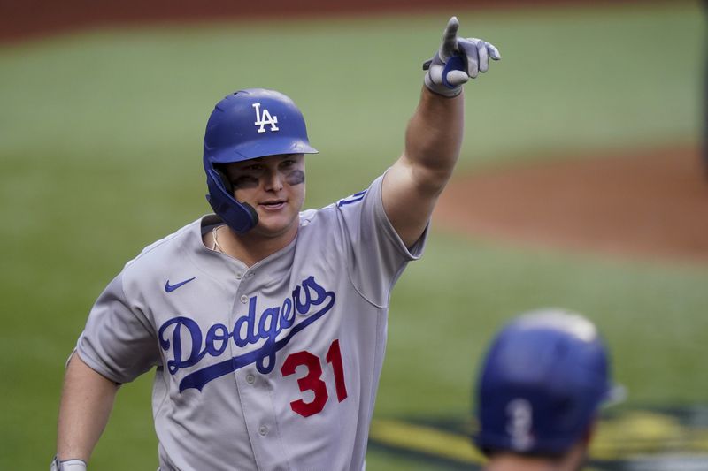 FILE - In this Oct. 14, 2020, file photo, Los Angeles Dodgers' Joc Pederson celebrates a three-run home run during the first inning in Game 3 of a baseball National League Championship Series against the Atlanta Braves in Arlington, Texas. (AP Photo/Eric Gay, File)