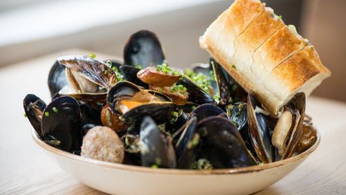 Dishes such as Bangs Island mussels with andouille, caper butter, and crusty bread await at Scout in Oakhurst. CONTRIBUTED BY MIA YAKEL