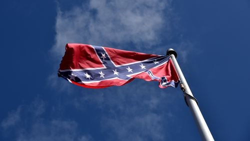 Kennesaw leaders will vote Monday to consider keeping the Confederate battle flag permanently off its war memorial. BRANT SANDERLIN/BSANDERLIN@AJC.COM