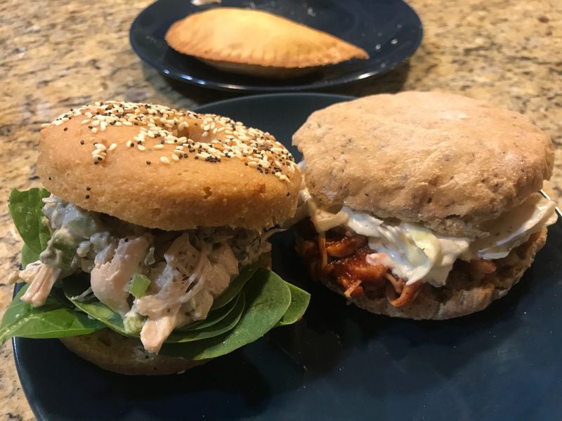 Hand-helds at Huh! include, from left, chicken salad sandwiches, savory empanadas and barbecue jackfruit sandwiches. LIGAYA FIGUERAS / LIGAYA.FIGUERAS@AJC.COM