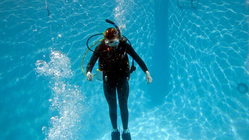 Sydney Aitkens, 16, of Macon, practices her scuba diving skills during Part 2 of the scuba diving class for certification at SeaVentures Scuba and Swim, Saturday, January 30, 2016, in Alpharetta, Ga.