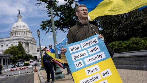 Activists supporting Ukraine demonstrate April 20 outside the U.S. Capitol in Washington. (J. Scott Applewhite/AP)
