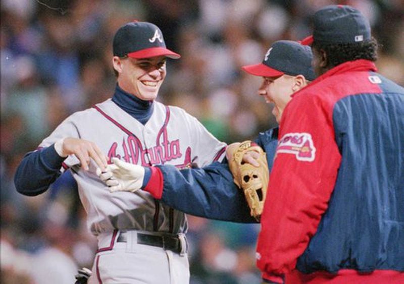 Braves third baseman Chipper Jones, left, who hit the winning home run in the 8th inning is greeted by pitcher Steve Avery after the Braves beat the Rockies 5-4. The Braves Clarence Jones has his back to the camera. Young Chipper Jones was a force from the get-go after he reached the majors.