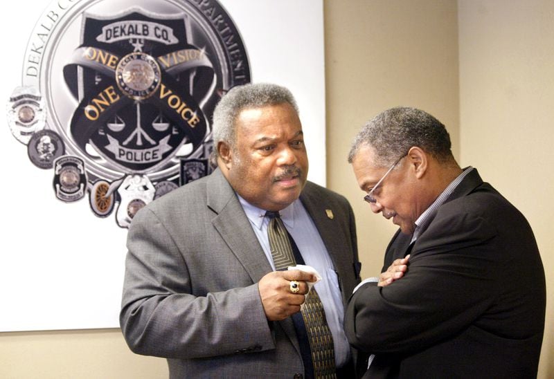 DeKalb County Chief of Police Louis Graham, left,  has a quiet conversation with Wayne Williams' attorney, Lynn Whatley, right, of Whatley, Stephenson, Voles, LLC law office after a news conference Wednesday, May 11, 2005 introducing a cold case squad that will reinvestigate five unsolved murders. "Things are in motion now," Whatley said, "powerful evidentiary things are coming about."  (JENNI GIRTMAN/AJC staff)