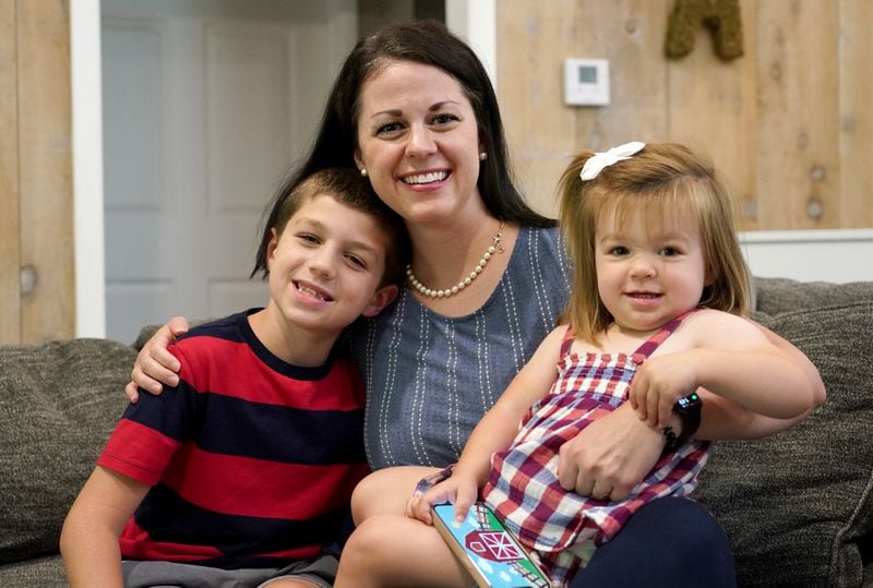 Misti Allison poses with her son, Blake, and her daughter, Audrey, at her home, Saturday, July 15, 2023, in East Palestine. Allison testified before a Senate committee in March concerning the Feb. 3, 2023, Norfolk Southern freight train derailment. (Matt Freed for the Atlanta Journal Constitution)