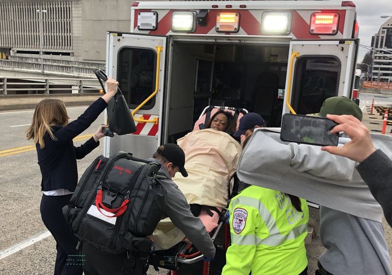 Katrina Taylor-Parks, the deputy chief of staff to former Atlanta Mayor Kasim Reed, is led out of the Richard B. Russell Federal Building by paramedics after she collapsed during her sentencing in the federal probe of corruption at Atlanta City Hall. 
