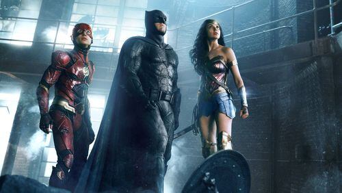 Ezra Miller as The Flash, Ben Affleck as Batman and Gal Gadot as Wonder Woman star in the film “Justice League.” Contributed by Warner Bros. Pictures