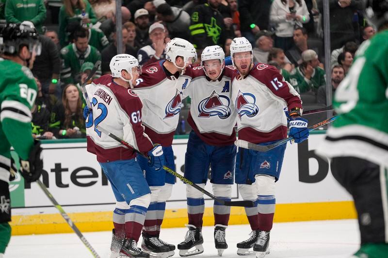 Colorado Avalanche's Artturi Lehkonen (62), Mikko Rantanen, second from left, Cale Makar (8) and Valeri Nichushkin (13) celbrate a goal scored by Makar in the second period in Game 2 of an NHL hockey Stanley Cup second-round playoff series against the Dallas Stars in Dallas, Tuesday, May 7, 2024. (AP Photo/LM Otero)