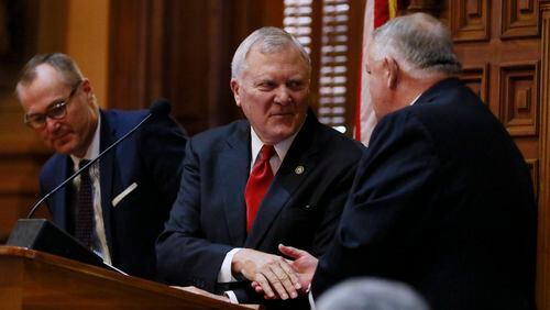 Gov. Nathan Deal shakes hand with Speaker David Ralston (right) and Lt. Gov. Casey Cagle following his State of the State address for 2017 before a joint session of the General Assembly. BOB ANDRES /BANDRES@AJC.COM