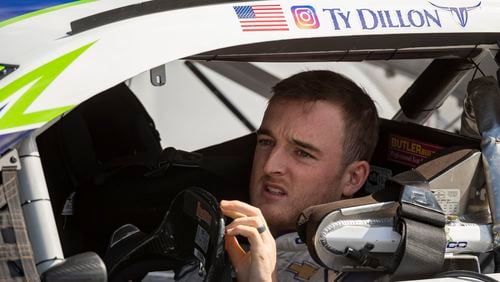 Driver Ty Dillon, here awaiting the start of a race last year, has had plenty to say in this time of unrest. (AP Photo/Brien Aho)