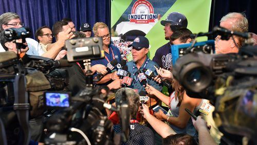 Chipper Jones talks about his busy week in Cooperstown with a few interested media types. (HYOSUB SHIN / HSHIN@AJC.COM)