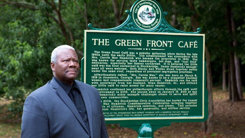 Stockbridge City Councilman Alphonso Thomas poses for a portrait next to a historical marker for Green Front Cafe next to the building in Stockbridge, Ga., on Tuesday, June 4, 2019. Thomas grew up with the cafe and fondly recalled his childhood in the neighborhood. The small building is a well-loved community fixture that thrived under the ownership of Carrie Mae Hambrick, who Thomas worked for, and served as a town watering hole from its opening in 1947 through the early 2000s. The cafe is now in the process of being revived under the ownership of Diane Miller. (Casey Sykes for The Atlanta Journal-Constitution)