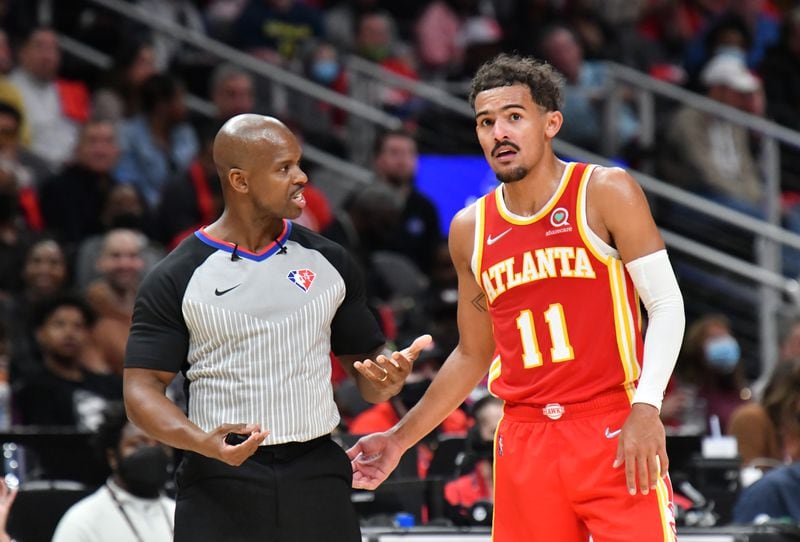 Hawks guard Trae Young (11) appeals to a referee during the second half of the home opener in a NBA basketball game at State Farm Arena on Thursday, October 21, 2021. Atlanta Hawks won 113 - 87 over Dallas Mavericks. (Hyosub Shin / Hyosub.Shin@ajc.com)