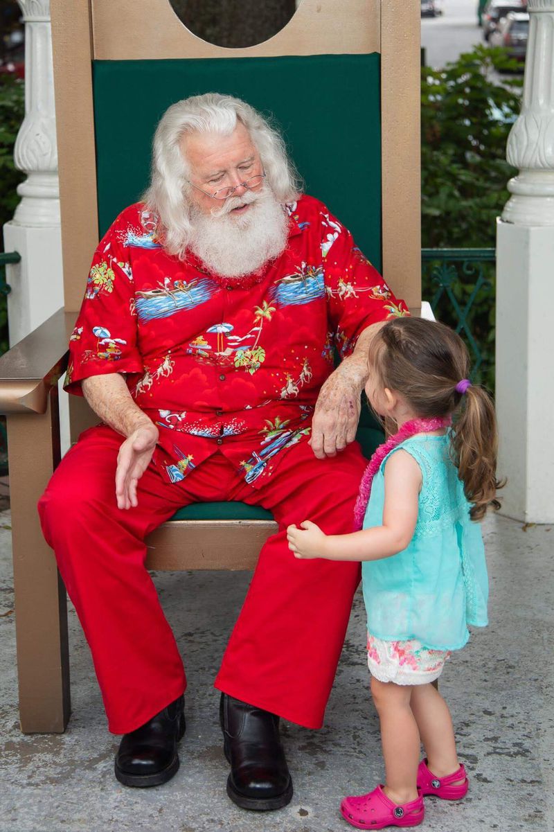 Santa greets children at Marietta Square’s Christmas in July program. Contributed by Hadley’s Photography