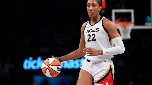 FILE - Las Vegas Aces' A'ja Wilson (22) looks to pass during the first half in Game 3 of a WNBA basketball final playoff series against the New York Liberty Sunday, Oct. 15, 2023, in New York. Wilson, Breanna Stewart and Brittney Griner will be back on the courts chasing another WNBA title when camps open on Sunday, April 28. (AP Photo/Frank Franklin II, File)