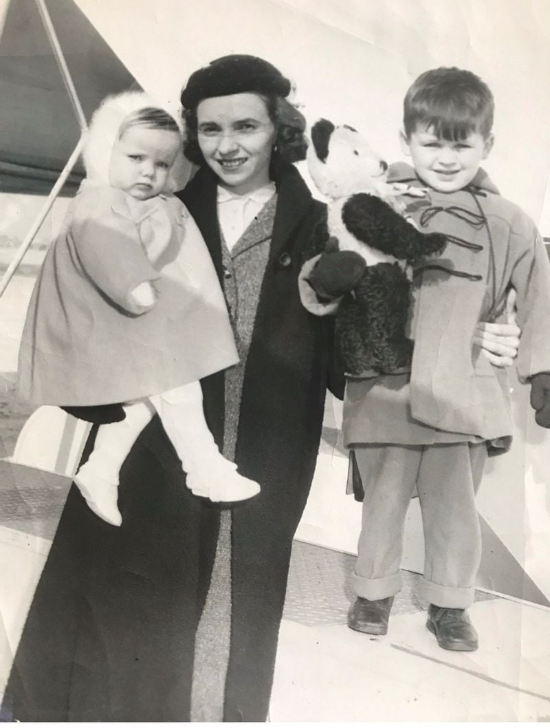A newspaper photo from 1955 when Helen Gilligan brought two Irish children to Chicago for adoption.