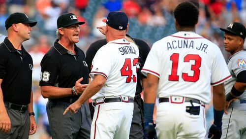 ATLANTA, GA - AUGUST 15:  Manager Brian Snitker #43 of the Atlanta Braves argues with the umpires after Ronald Acuna Jr. #13was hit by a pitch during the first inning against the Miami Marlins at SunTrust Park on August 15, 2018 in Atlanta, Georgia. (Photo by Daniel Shirey/Getty Images)
