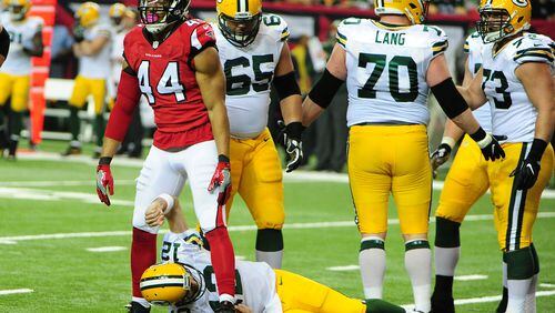 Falcons defensive end Vic Beasley stands over Aaron Rodgers Packers after a sack at the Georgia Dome on October 30, 2016 in Atlanta.