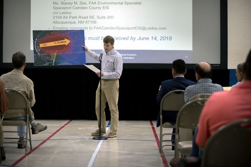 KINGSLAND, GA - APRIL 11, 2018: Camden County resident Kevin Lang, center, holds a graphic showing a model explosion pattern from a FAA study of a Falcon One Rocket during a public hearing to discuss during a public hearing about a potential site for a spaceport in Kingsland, Georgia. (AJC Photo/Stephen B. Morton)