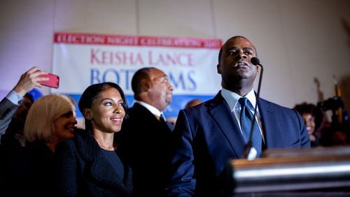 Kasim Reed introduces Atlanta mayoral candidate Keisha Lance Bottoms, who is claiming victory over Mary Norwood, during a runoff election night party at the Hyatt Regency Hotel, Tuesday, Dec. 5, 2017, in Atlanta.  BRANDEN CAMP/SPECIAL