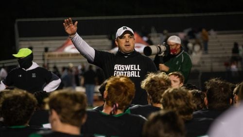 Chris Prewett, head varsity football coach for Roswell, speaks to his team after their victory against Mill Creek on Friday, November 27, 2020, at Roswell High School in Roswell, Georgia. Roswell defeated Mill Creek 28-27. CHRISTINA MATACOTTA FOR THE ATLANTA JOURNAL-CONSTITUTION