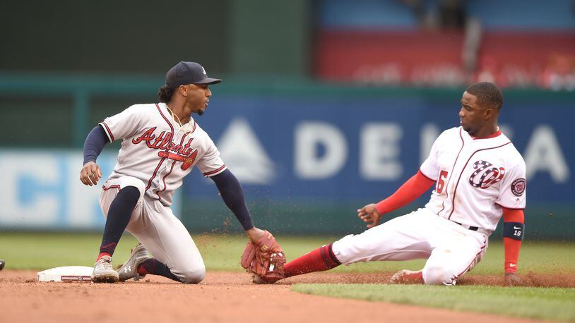 Braves second baseman Ozzie Albies tags out Washington's Victor Robles attempting to steal second base in the second inning Sept. 14, 2019, at Nationals Park in Washington, D.C.