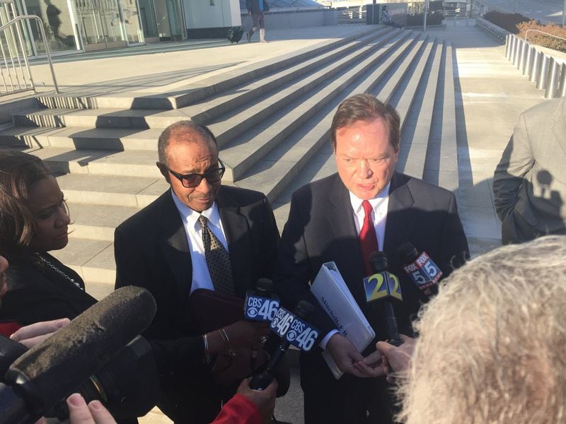 Elvin “E.R.” Mitchell Jr., left, stands with his attorney, Craig Gillen, before a crowd of reporters outside the federal courthouse in downtown Atlanta on Wednesday, Jan. 25, 2017. Mitchell pleaded guilty to conspiring to pay more than $1 million in bribes as part of a scheme to win city of Atlanta contracts. Dave Huddleston/Channel 2 Action News