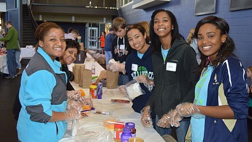 A scene from the 2017 sandwich-making at the Ed Isakson/Alpharetta Family YMCA. About 500 volunteers willl turn out Jan. 14 to make nearly 6,000 sandwiches for the homeless as a Martin Luther King Jr. Day service project. ED ISAKSON/ALPHARETTA FAMILY YMCA
