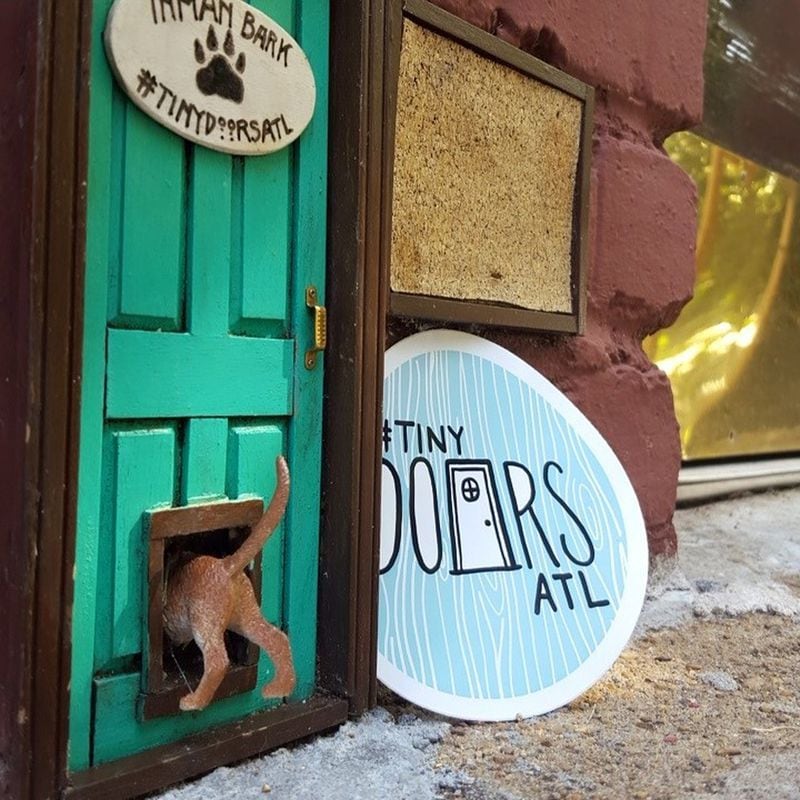One tiny door wasn’t good enough for Tiny Doors ATL, which included a tiny doggie door within the door outside Inman Park Pet Works. CONTRIBUTED BY TINY DOORS ATL