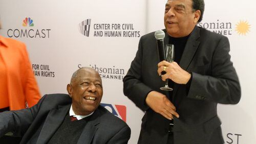 Hank Aaron (left) gets feted by Ambassador Andrew Young Feb. 5, 2016 before a screening of the Smithsonian documentary. It was Aaron's 82nd birthday. CREDIT: Rodney Ho/ rho@ajc.com