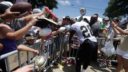 Adrian Peterson is popular with autograph seekers, but how much does he have left to help the New Orleans Saints? (AP Photo/Gerald Herbert)