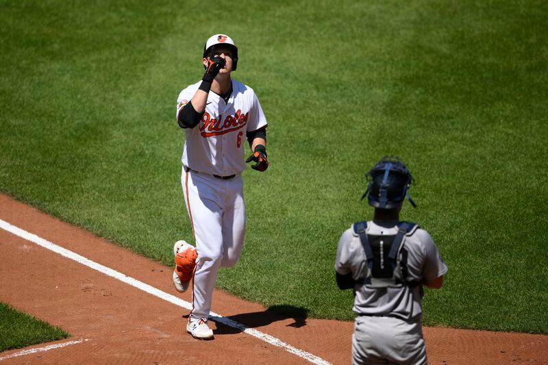 Baltimore Orioles' Ryan Mountcastle, left, celebrates his home run as New York Yankees catcher Austin Wells looks on at right, during the third inning of a baseball game, Thursday, May 2, 2024, in Baltimore. (AP Photo/Nick Wass)