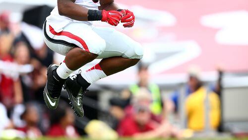 COLUMBIA, SC - SEPTEMBER 13: Todd Gurley #3 of the Georgia Bulldogs jumps before the kickoff against the South Carolina Gamecocks at Williams-Brice Stadium on September 13, 2014 in Columbia, South Carolina. (Photo by Streeter Lecka/Getty Images) Todd Gurley and Georgia should have an easy game today against Troy. (Streeter Lecka/Getty Images)
