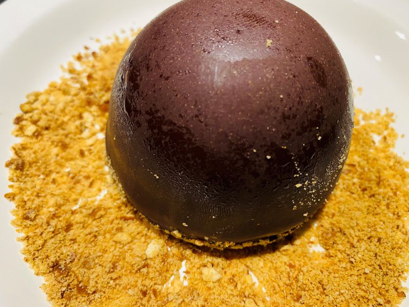 Chocolate grotto, with salted caramel filling and pretzel dust, is a dessert favorite at Canoe. Bob Townsend for The Atlanta Journal-Constitution 