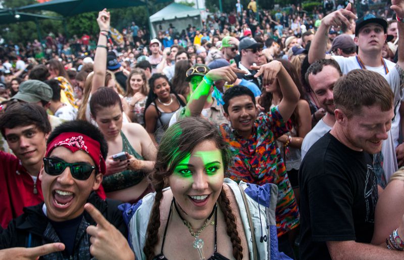 Festival attendees enjoy music from the DJ stage at the SweetWater 420 Fest in downtown Atlanta, Ga., on Saturday, April 18, 2015. April showers left the festival grounds ankle-deep in mud, but the event still drew more than 20,000 people on Staurday. (AP Photo/ Ron Harris) Festival attendees enjoy music from the DJ stage at the SweetWater 420 Fest in downtown Atlanta, Ga., on Saturday, April 18, 2015. April showers left the festival grounds ankle-deep in mud, but the event still drew more than 20,000 people on Staurday. (AP Photo/ Ron Harris)