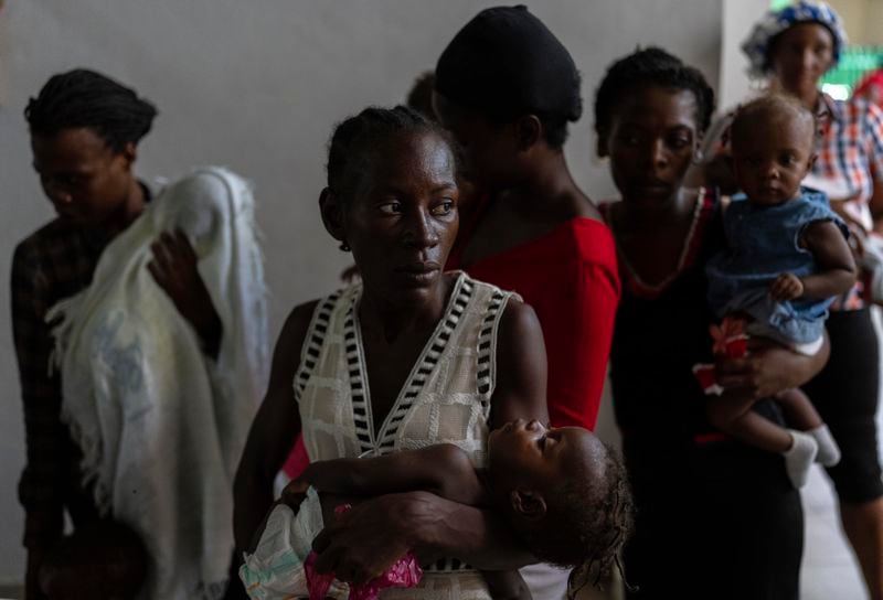Women and malnourished children wait their turn to be weighed by health personnel at La Paix University Hospital, in Port-au-Prince, Haiti, Wednesday, May 8, 2024. (AP Photo/Ramon Espinosa)