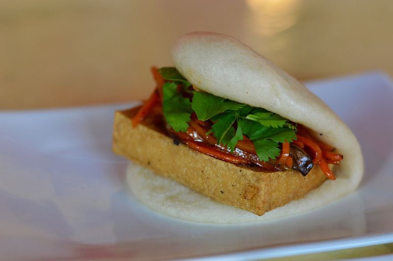 The Veggie Bao at Ah-Ma’s Taiwanese Kitchen features a large piece of fried tofu. (photo: Henri Hollis for the AJC)