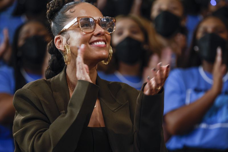 Singer Alicia Keys enjoys a song sung by The Spelman College Glee Club on Sept. 23, 2022. She is among the musicians who back a proposal by a Georgia congressman that would limit prosecutors’ ability to use rap lyrics as evidence in criminal trials. (Natrice Miller/AJC)  

