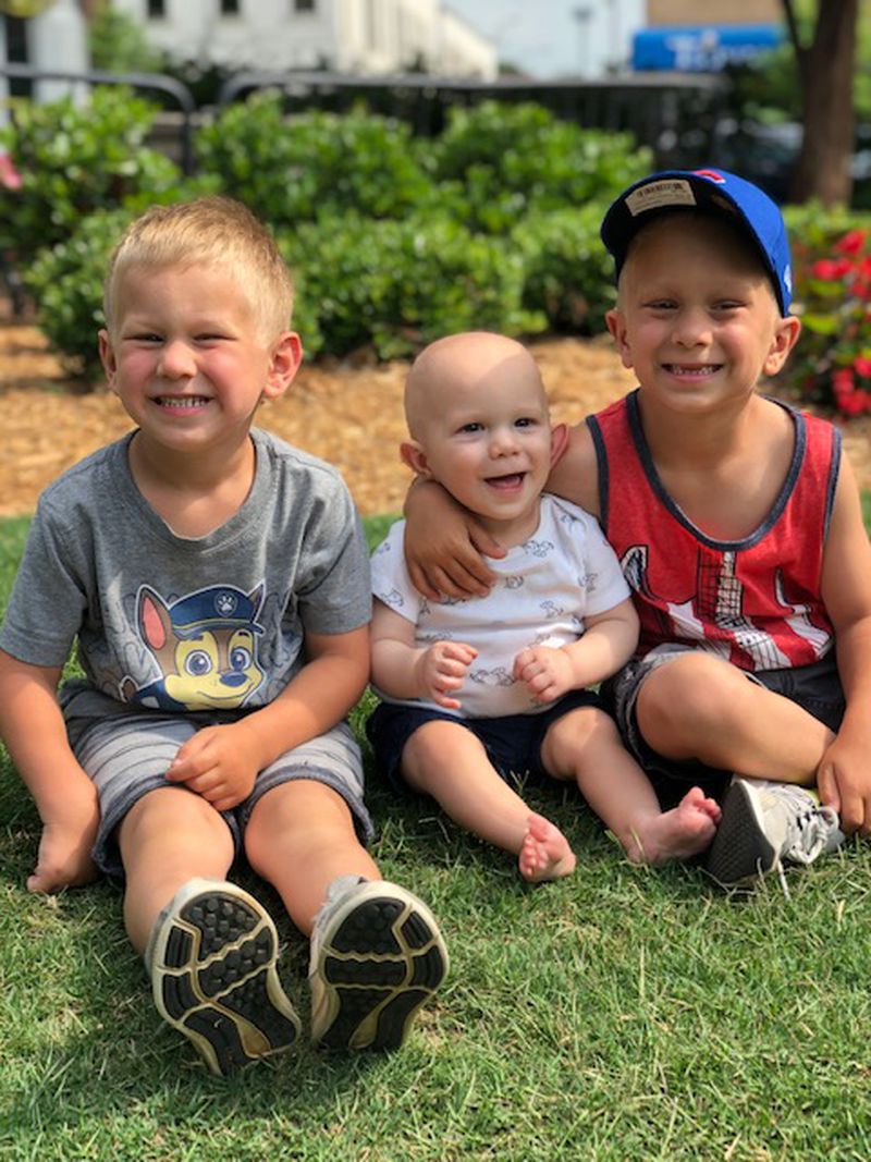 Tristen, Caison, and Carter Rush enjoy a family outing in Marietta Square at the end of May.