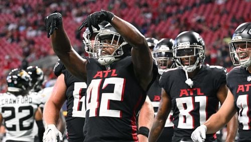 Falcons running back Caleb Huntley (42) celebrates after scoring a touchdown during the final exhibition game of the preseason at Mercedes-Benz Stadium in Atlanta at on Saturday, August 27, 2022. (Hyosub Shin / Hyosub.Shin@ajc.com)
