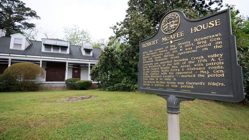 The sign on the side of the historic house shows part of what happened almost two centuries ago. The Eliza and Robert McAfee house in Marietta is in the midst of a dispute to find a solution for its fate.
Miguel Martinez /miguel.martinezjimenez@ajc.com