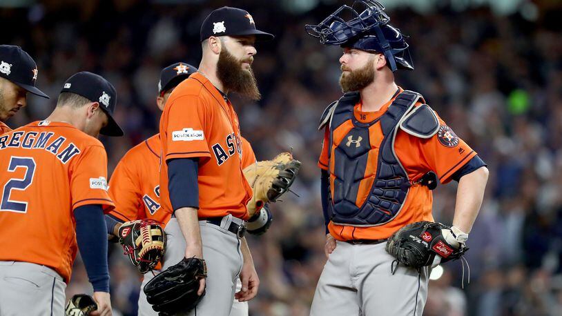 Dallas Keuchel confers with catcher Brian McCann. They will be reunited on the Braves.