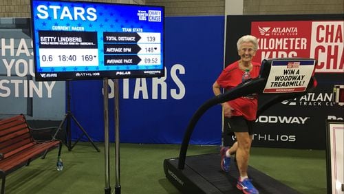 Betty Lindberg runs on a treadmill during a charity event. She will run her 28th Atlanta Journal-Constitution Peachtree road race this year. (Contributed)