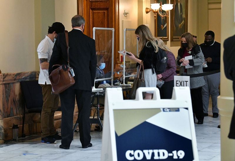 Lawmakers and staff line up for COVID-19 testing at the Georgia Capitol early in this year's legislative session. (Hyosub Shin/Atlanta Journal-Constitution/TNS)