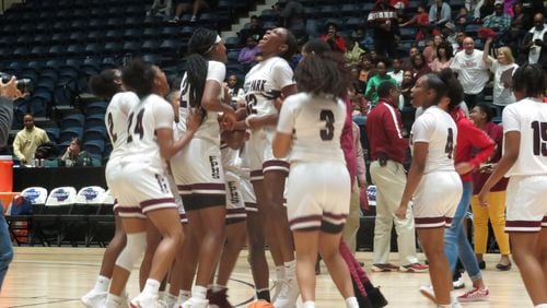 The Forest Park Lady Panthers celebrate their 46-30 victory over the Glynn Academy Terrors in the Class AAAAAA state championship on Saturday, March 7, 2020 at the Macon Centreplex. (Adam Krohn for the AJC)